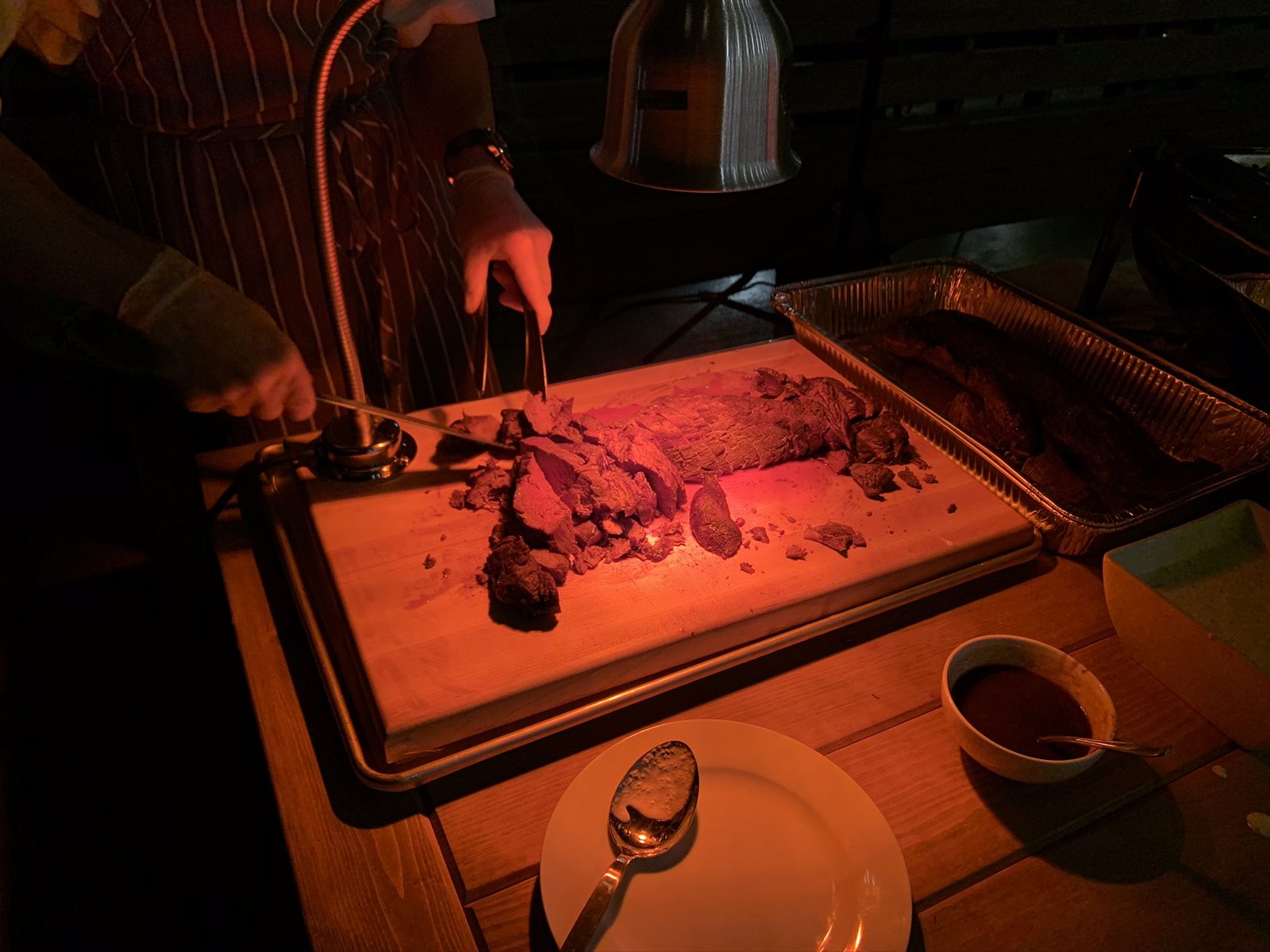 Rows of candles lining the pathway to the pavilion at night