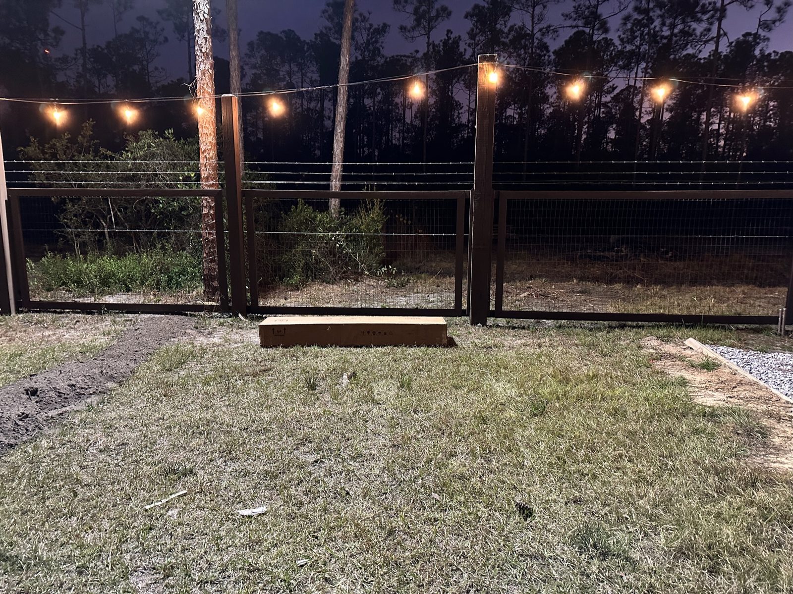 Stone fountain circle with ornamental grasses on the Point Preserve grounds