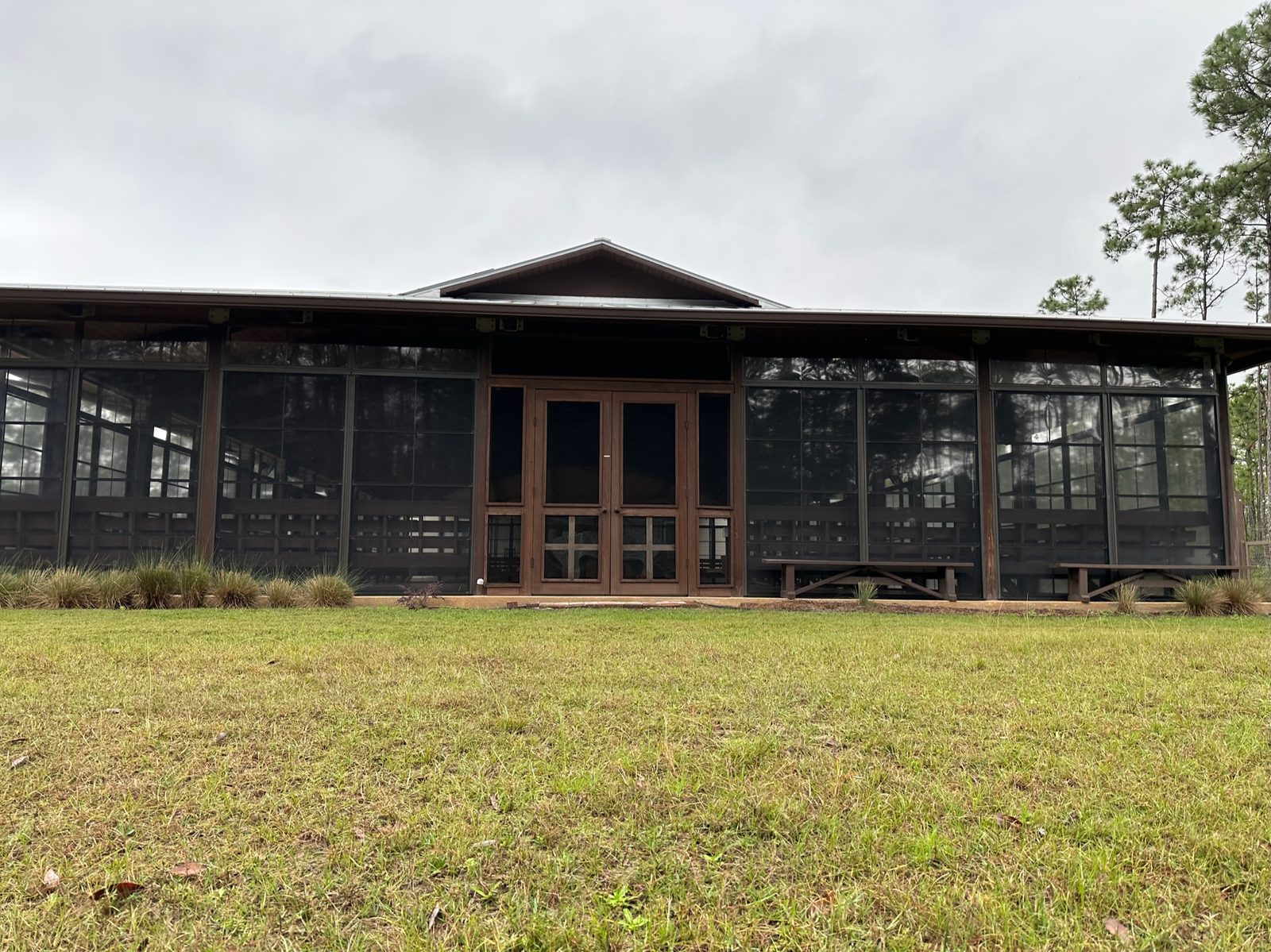 Point Preserve pavilion seen from the lawn, framed by longleaf pines